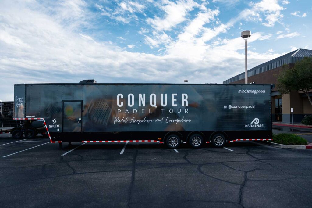 Conquer Padel Tour trailer parked outside, promoting mobile padel activations across the U.S.