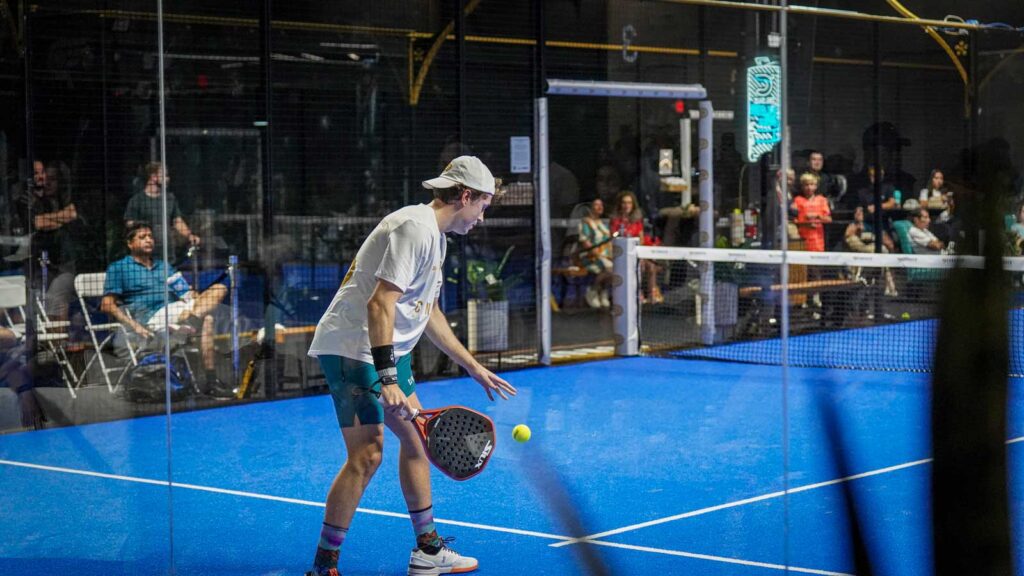 Padel players rallying indoors at Conquer Padel Tempe, showcasing the sport’s energy and growing presence in the U.S.